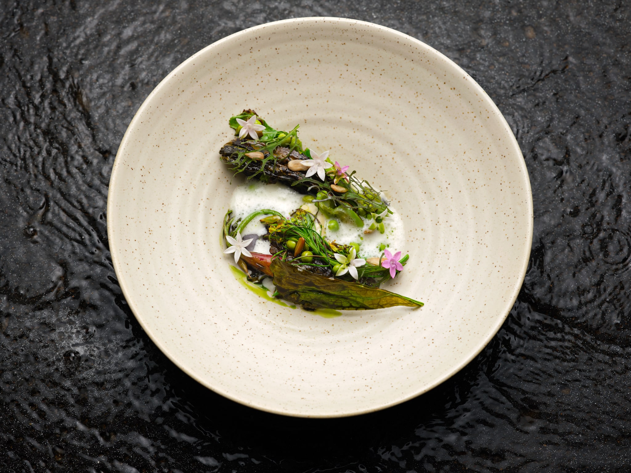 A salad dish beautifully presented on a plate